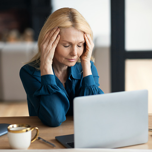 woman suffering from depression sitting on couch